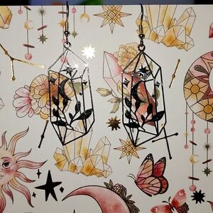 Geometric crystal moon earrings.